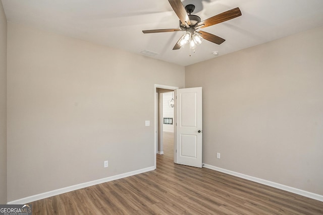 unfurnished room with hardwood / wood-style floors and ceiling fan