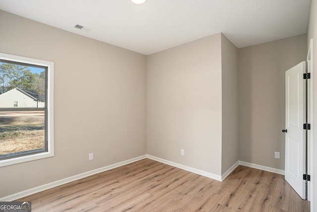 empty room with light wood-type flooring