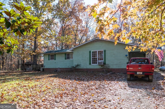 view of side of property featuring cooling unit