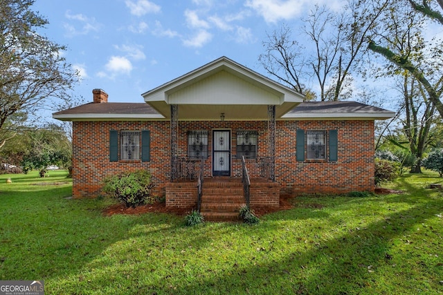 view of front of house featuring covered porch and a front lawn