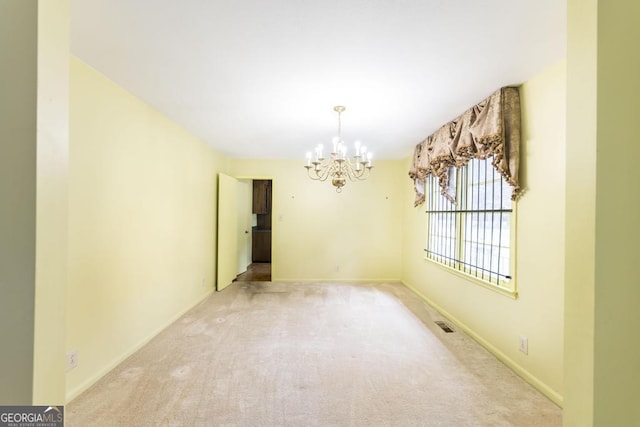 6909 Forsyth Rd, Macon, GA 31210 - unfurnished dining area featuring a chandelier and carpet