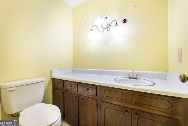 bathroom with vanity and toilet