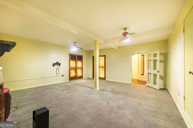 interior space featuring beam ceiling, carpet floors, and ceiling fan