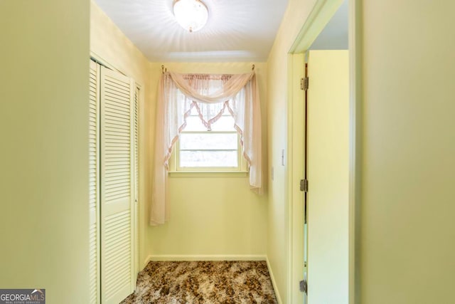 hallway with carpet flooring