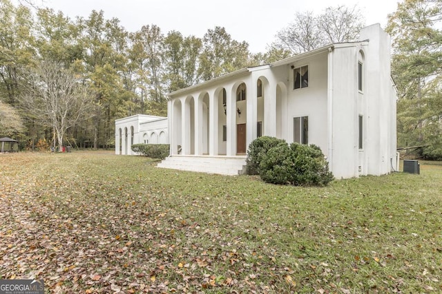 6909 Forsyth Rd, Macon, GA 31210 - back of house with a lawn
