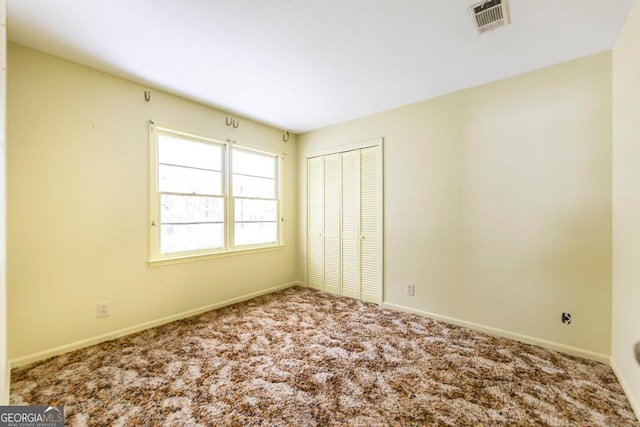 view of carpeted spare room