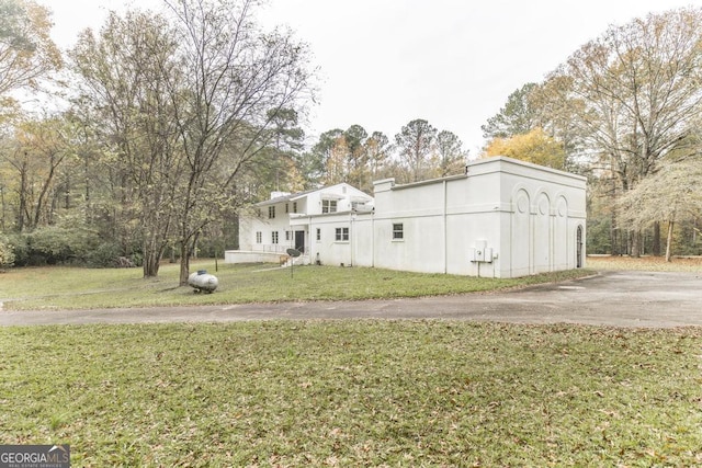 6909 Forsyth Rd, Macon, GA 31210 - view of front facade featuring a front lawn