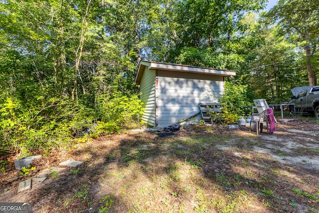 exterior space with a storage shed