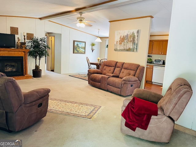 carpeted living room featuring lofted ceiling with beams, ceiling fan, and crown molding