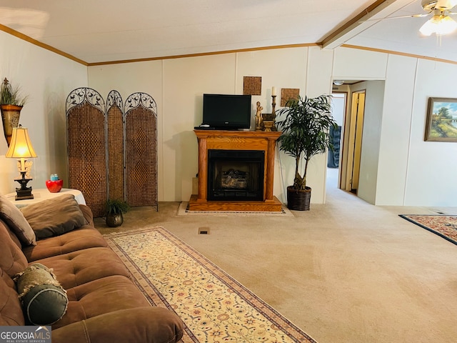 living room featuring carpet flooring, vaulted ceiling with beams, ceiling fan, and crown molding