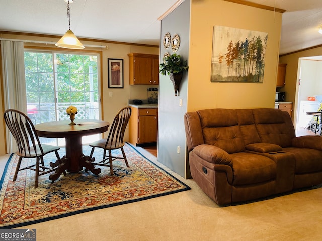 dining room with carpet floors and crown molding