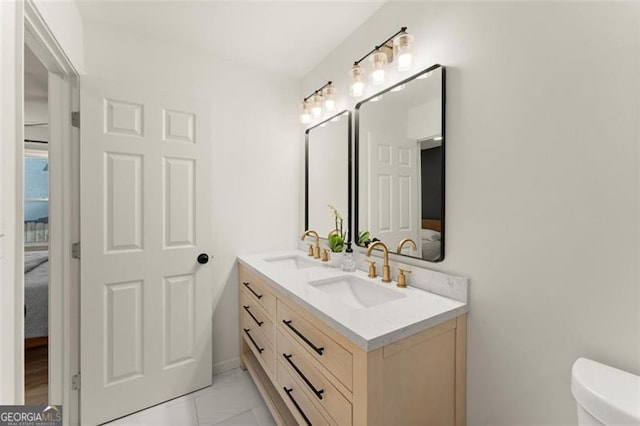 bathroom with vanity and toilet