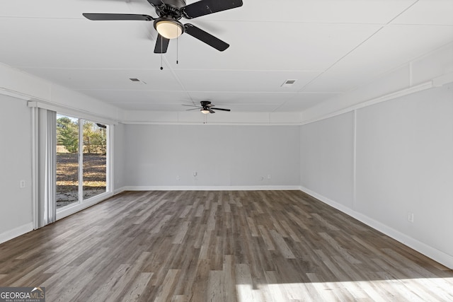 spare room with ceiling fan and hardwood / wood-style flooring