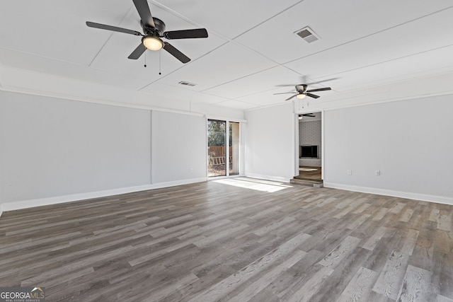 spare room featuring hardwood / wood-style floors and ceiling fan