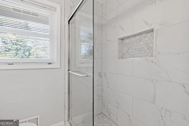 bathroom with walk in shower