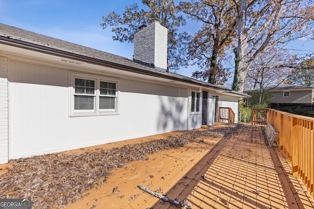 exterior space featuring a wooden deck