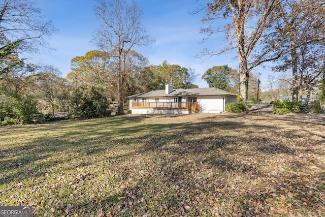 view of yard featuring a wooden deck