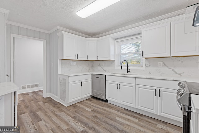 kitchen with stove, light wood-type flooring, stainless steel dishwasher, sink, and white cabinets