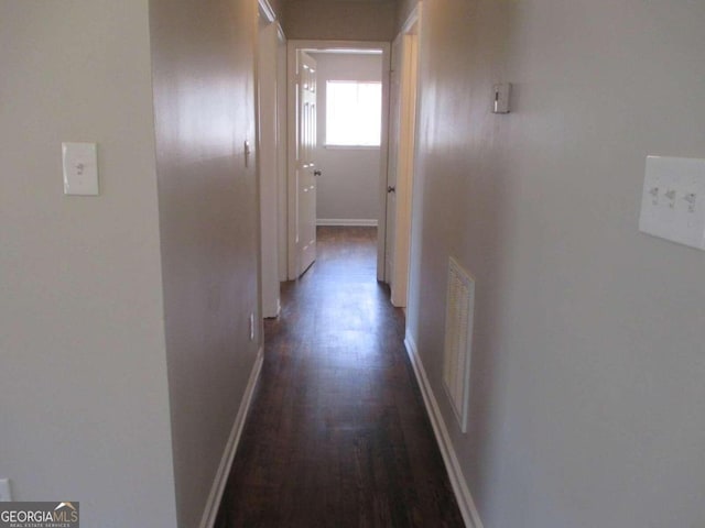 hall with dark hardwood / wood-style flooring