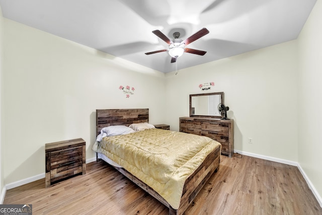 bedroom featuring ceiling fan and light wood-type flooring