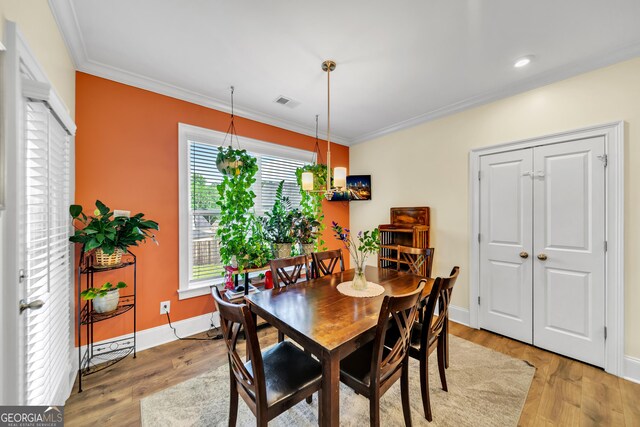 bedroom featuring a raised ceiling, ceiling fan, and crown molding