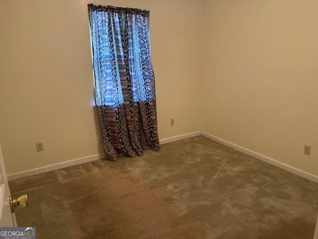 empty room featuring carpet floors