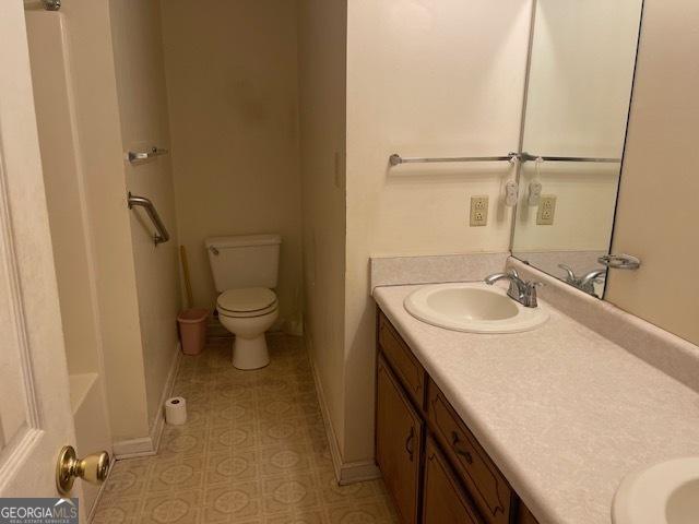 bathroom with vanity and toilet