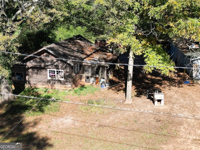 view of front of home featuring a sunroom