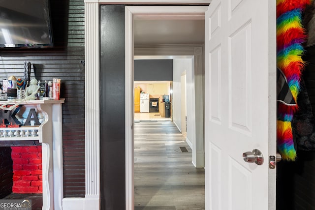 hallway with hardwood / wood-style flooring