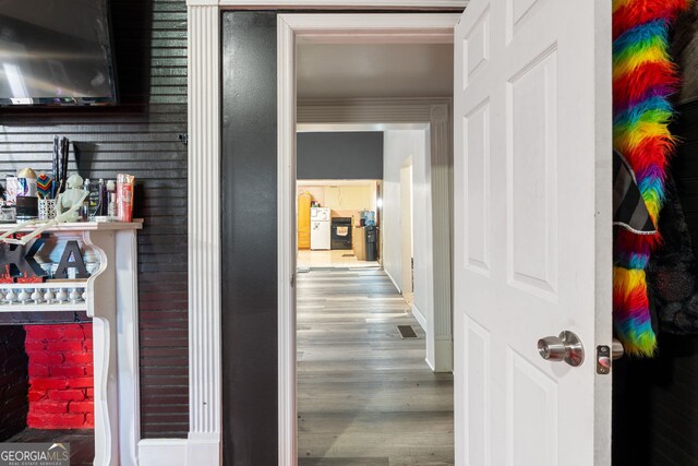 bedroom with a closet, light colored carpet, ceiling fan, and crown molding