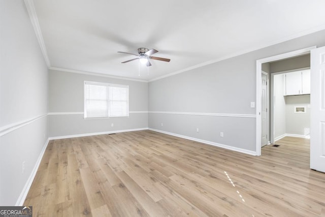 unfurnished room with light hardwood / wood-style floors, ceiling fan, and ornamental molding