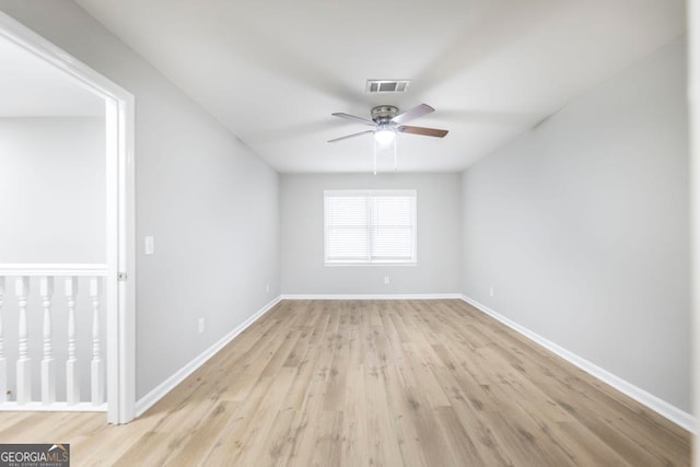 spare room with ceiling fan and light hardwood / wood-style flooring