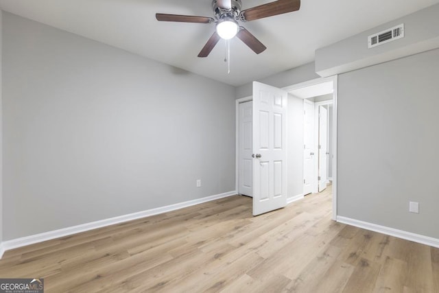 unfurnished bedroom featuring light hardwood / wood-style floors and ceiling fan