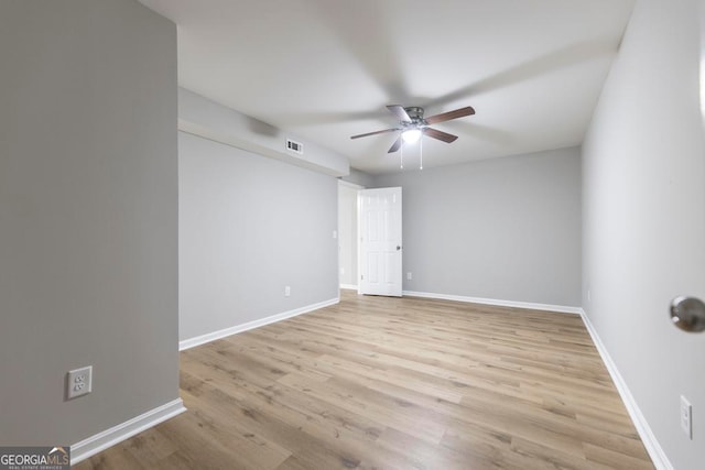 unfurnished room featuring light hardwood / wood-style flooring and ceiling fan