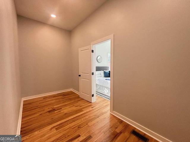 corridor with light wood-type flooring