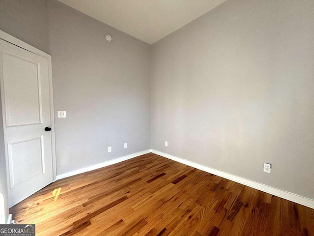 spare room featuring hardwood / wood-style floors