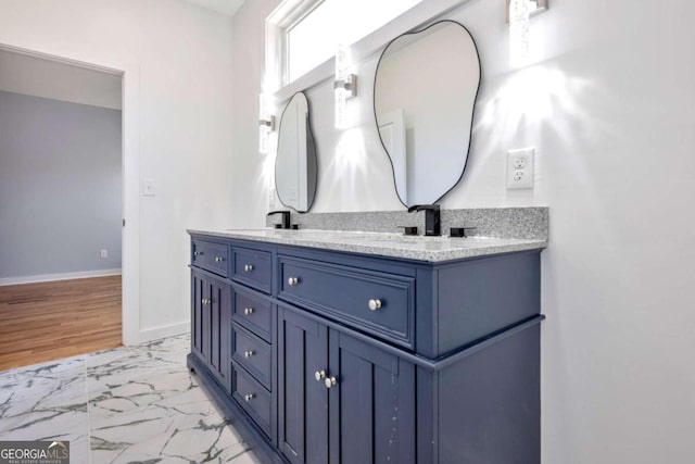 bathroom featuring vanity and hardwood / wood-style flooring