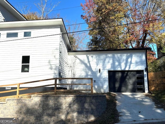 view of property exterior featuring a garage