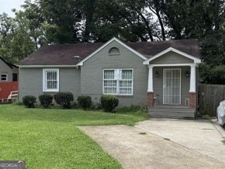 view of front of property with a front lawn