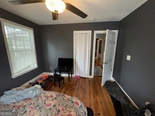 bedroom featuring ceiling fan and wood-type flooring