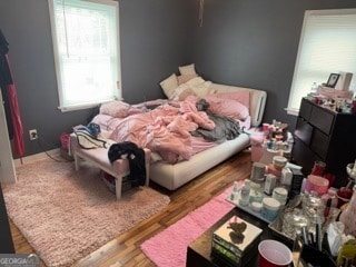 bedroom featuring wood-type flooring