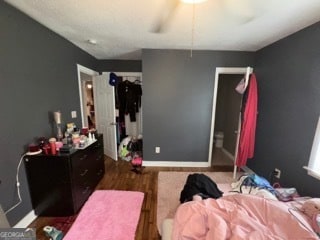 bedroom featuring dark wood-type flooring