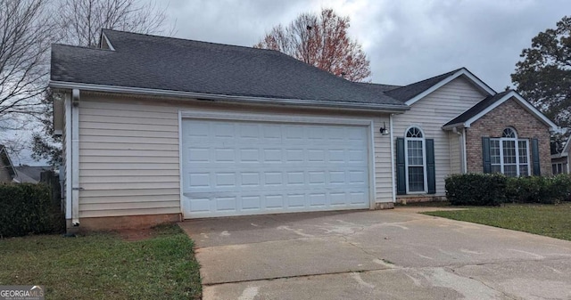 ranch-style house featuring a garage