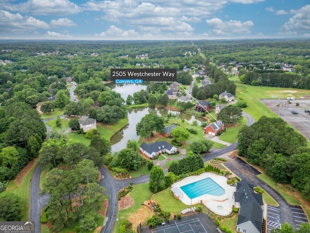 2505 Westchester Way, Conyers, GA 30013 - aerial view of a pool area, a forest, and a nearby body of water