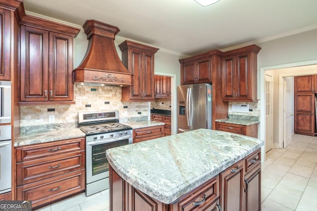 2505 Westchester Way, Conyers, GA 30013 - kitchen featuring appliances with stainless steel finishes, ventilation hood, light stone countertops, backsplash, and crown molding