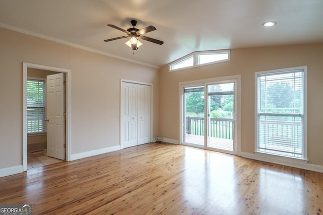 2505 Westchester Way, Conyers, GA 30013 - unfurnished bedroom with access to exterior, vaulted ceiling, wood finished floors, ornamental molding, and a ceiling fan