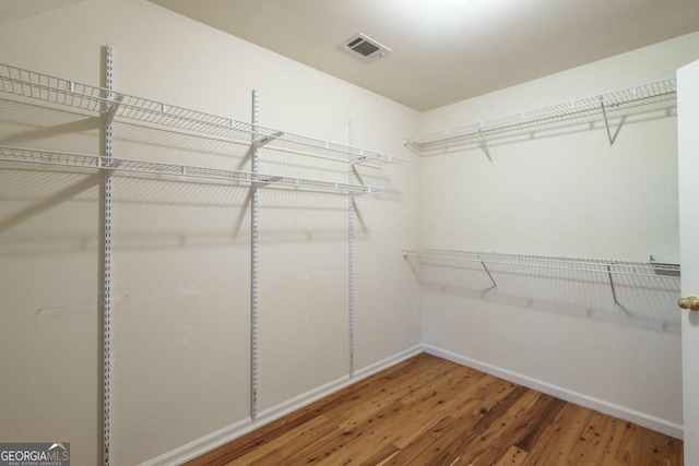 walk in closet featuring wood-type flooring