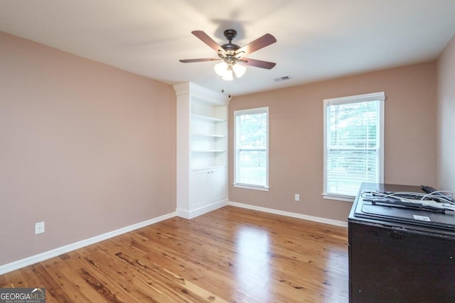 interior space with ceiling fan and light wood-type flooring