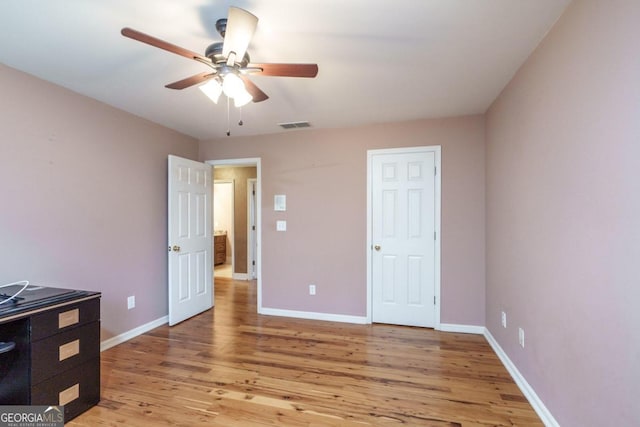 bedroom with ceiling fan and light hardwood / wood-style flooring