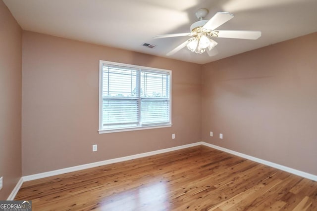 unfurnished room with ceiling fan and light hardwood / wood-style flooring